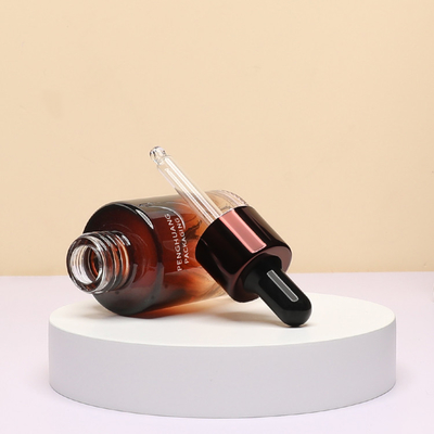 Le compte-gouttes en verre d'huile essentielle met des soins de la peau en bouteille vides faits sur commande de la peinture 30ml