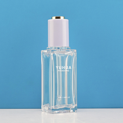 le conditionnement en plastique 50ml met la bouteille en bouteille claire de compte-gouttes de sérum de presse de bouton poussoir de torsion