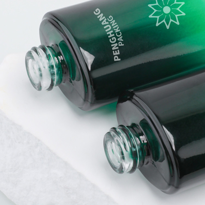 la bouteille de lotion en verre de la beauté 55ml a givré la lotion le cadeau que cosmétique de bouteille a placé le vert d'emballage de soins de la peau