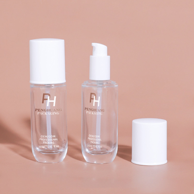 Forme ronde Bouteille de fondation liquide vide clair 30 ml 1 oz Bouteille de pompe à lotion en verre pour emballage cosmétique