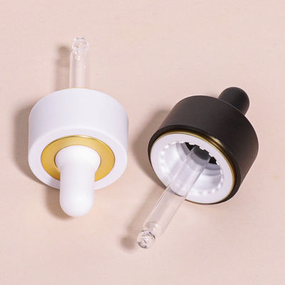 Bouteille gouttelette en verre ronde avec logo personnalisé selon les exigences du client