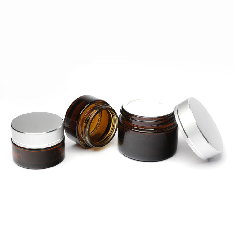 Ensemble d'emballages cosmétiques en verre offrant une surface de manipulation par sérigraphie avec logo personnalisé et personnalisation des couleurs